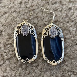 Black and gold Kendra Scott earrings.